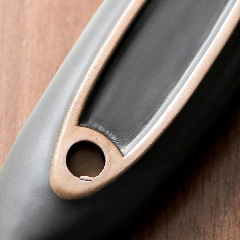 Ceramic incense holder side profile close-up showing matte exterior finish and tan inner rim detail