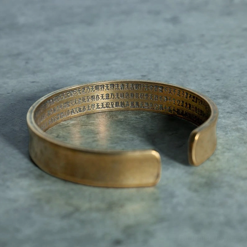 Buddhist bracelet with full Chinese sutra engraved on inner band, brass open cuff with vintage patina