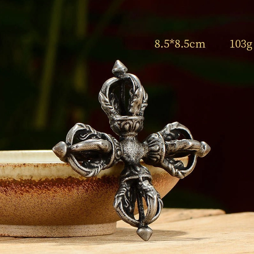 Iron double dorje vajra showing grounding strength - Buddhist vajra symbol for protection and unwavering spiritual power