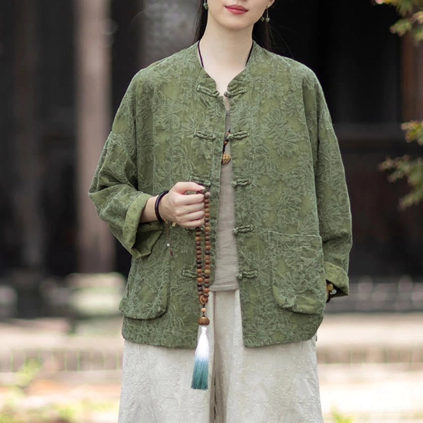 Front view of beige jacquard meditation top layered under olive green zen shirt with stand collar