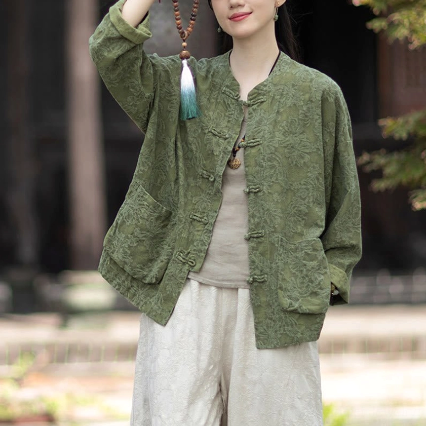 Unbuttoned jacquard meditation shirt revealing beige inner top, showing frog button detail and weave texture