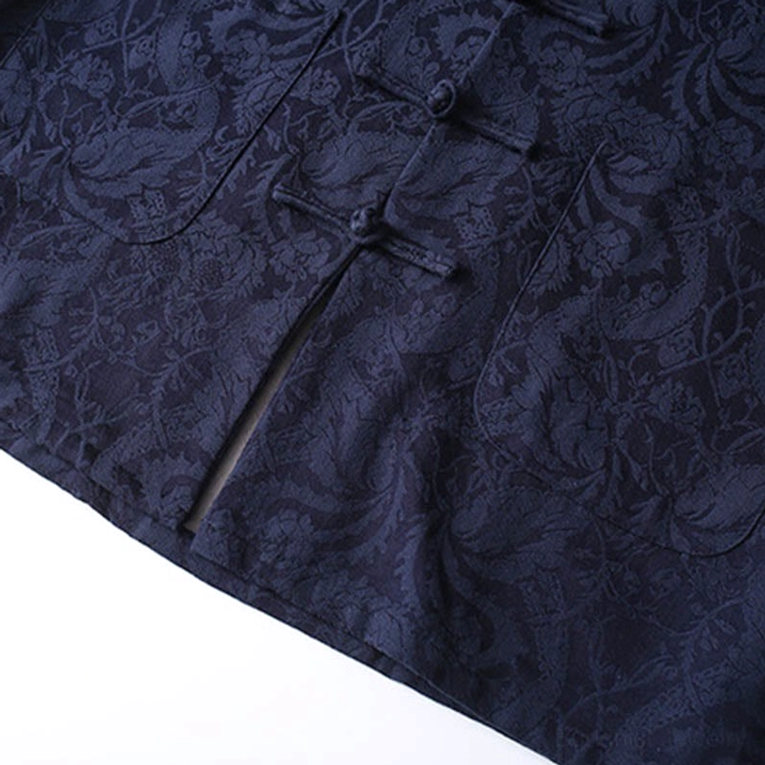 Close-up texture of navy jacquard vine pattern fabric - traditional weave with dense intricate design