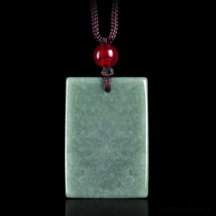Plain back view of smooth jade square pendant, demonstrating natural stone texture and bean-green color