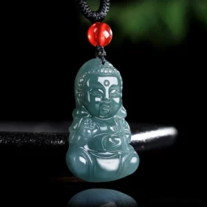 Jade Baby Buddha prosperity pendant necklace close-up front view with deep teal carved Buddha and red accent bead