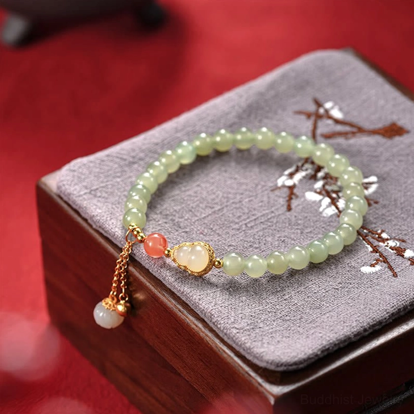 Hetian jade bracelet neatly arranged in embroidered wooden jewelry box display