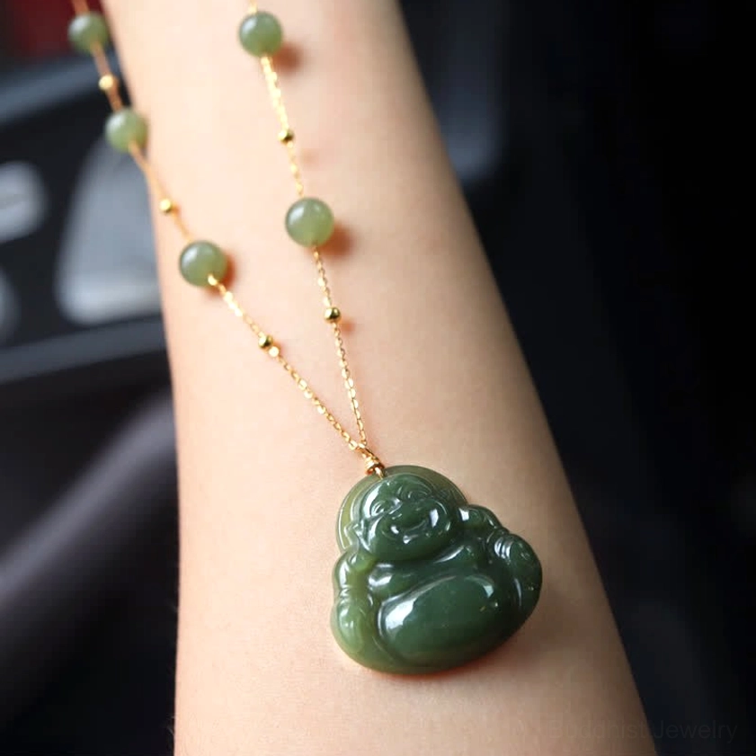 Laughing Buddha jade necklace personal styling display on forearm with olive green jade beads and gold chain detail
