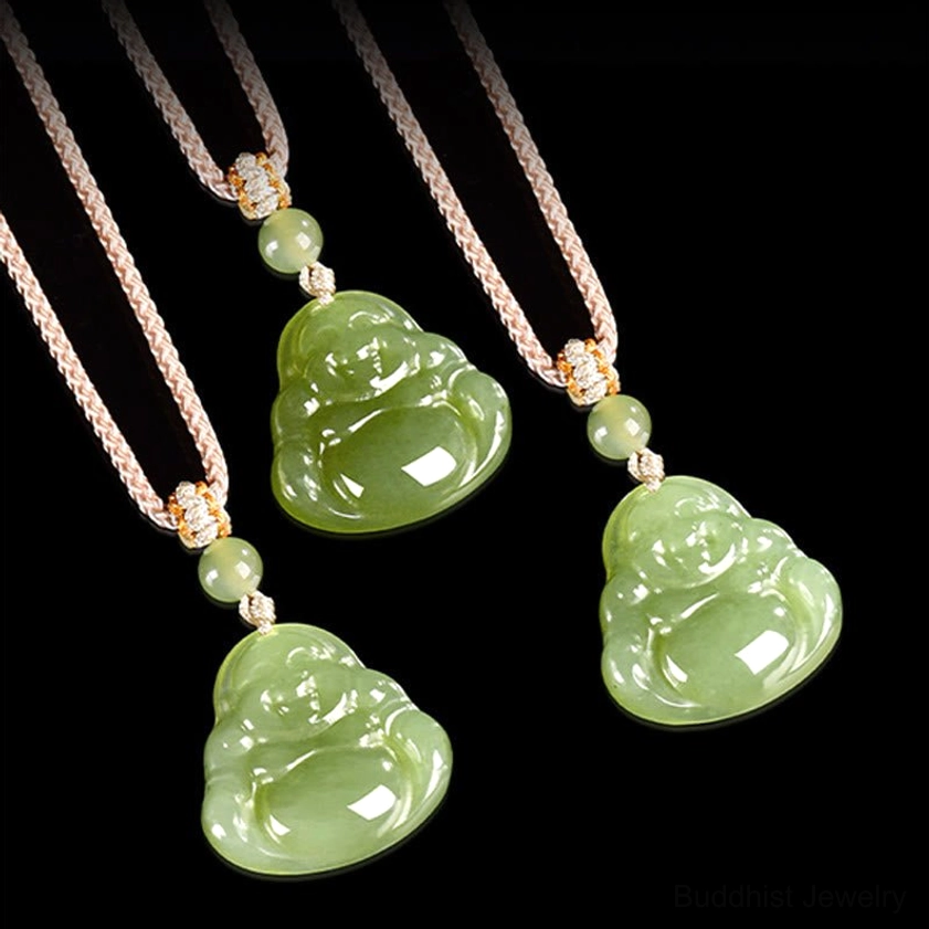Set of four matching green jade laughing Buddha necklaces displayed in overhead angled view showing consistency of carving and woven cord design