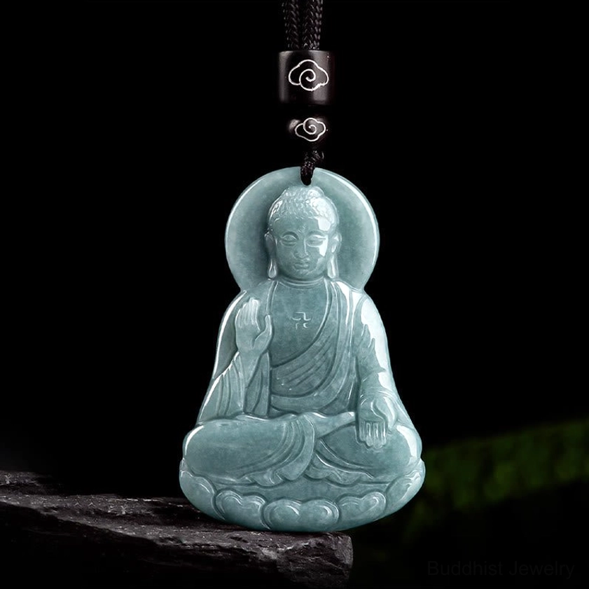 Amitabha Buddha jade pendant with black cloud-patterned cord bead polished natural jade on display stand