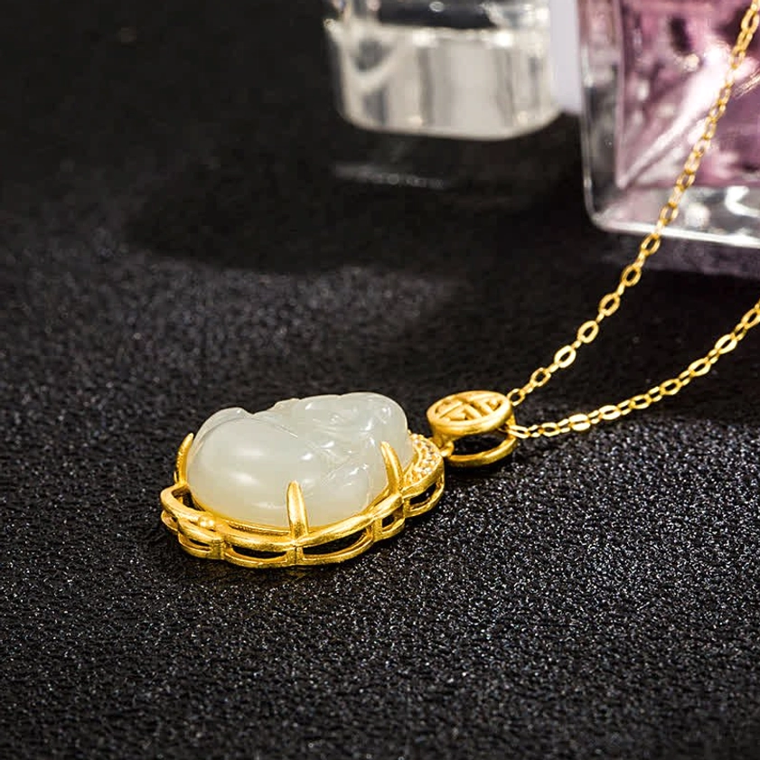 Laughing Buddha white jade pendant necklace low angle side view on black background, highlighting sterling silver chain and jade Buddha carving details