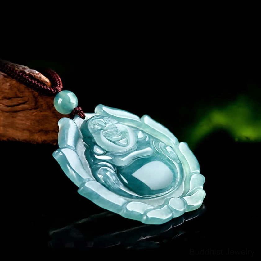 Side oblique view of jade laughing Buddha lotus pendant with brown necklace cord