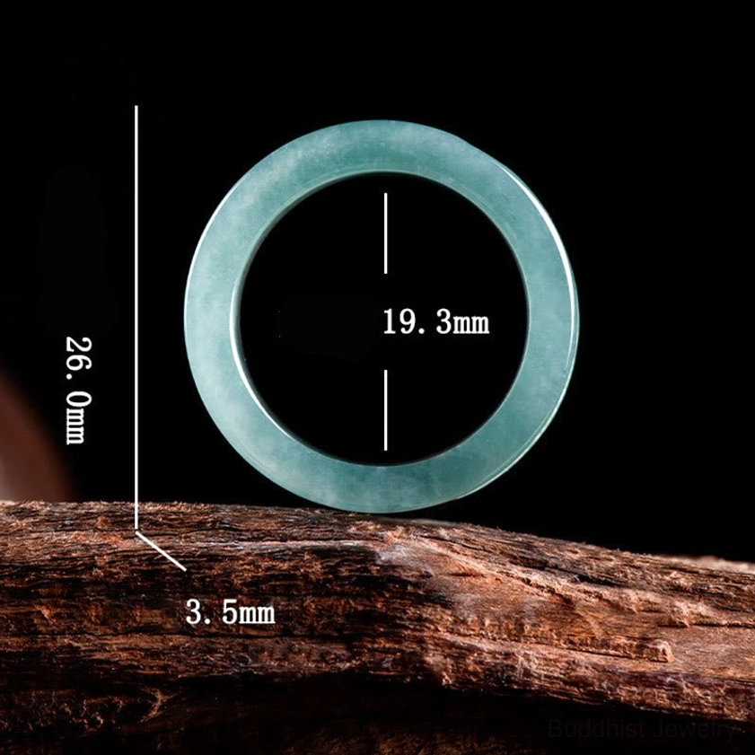 Overhead flat view of jade Om Mani Padme Hum ring specifications showing inner diameter 19.3mm, band width 26mm, thickness 3.5mm for accurate sizing