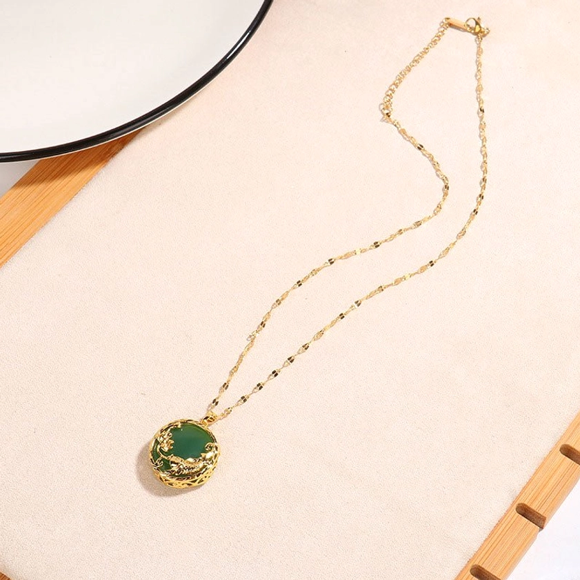 Full length jade koi fish lotus necklace lay flat overhead view with delicate gold chain