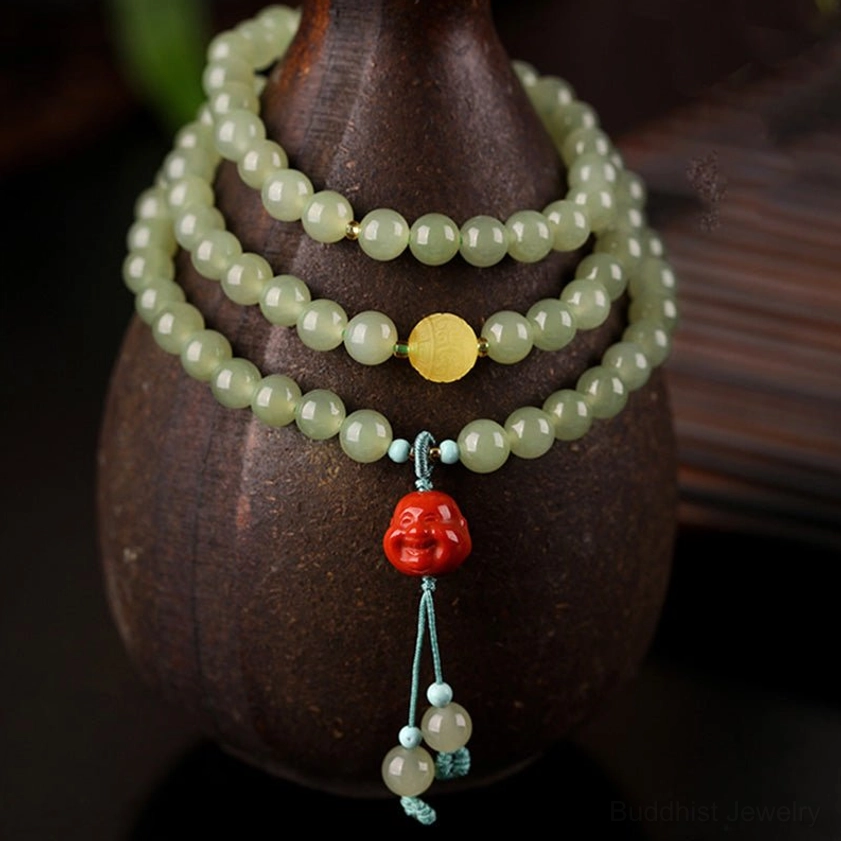 Triple-layer jade laughing Buddha prosperity bracelet displayed on ceramic stand with bamboo backdrop