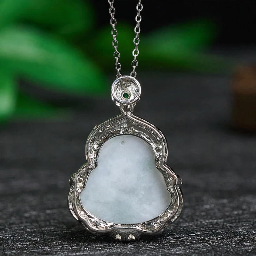 Back view of natural jade Laughing Buddha pendant showing plain jade surface and silver metal frame