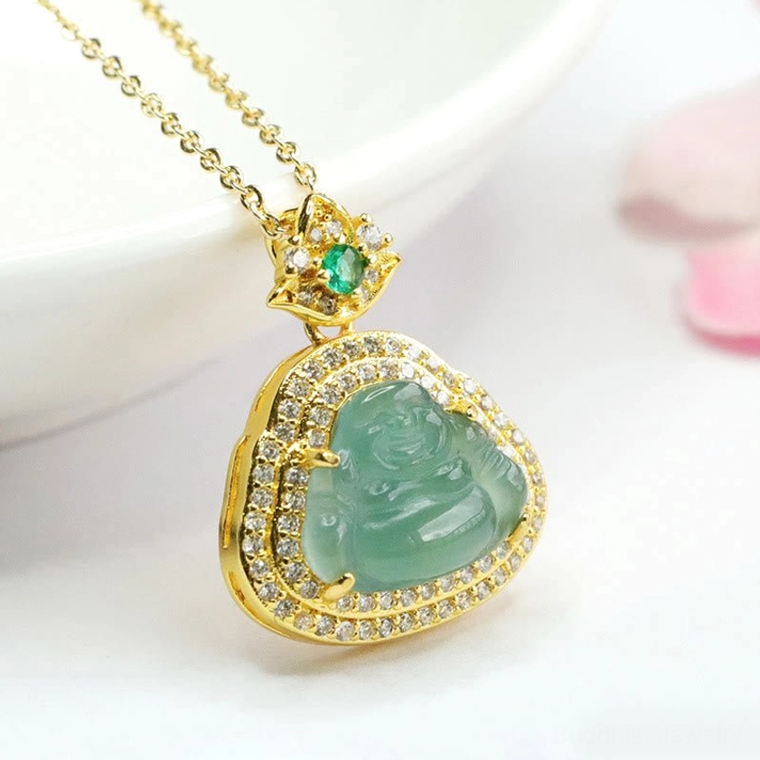 Elegant styled jade Buddha necklace with slim gold chain and gemstone bail on white background