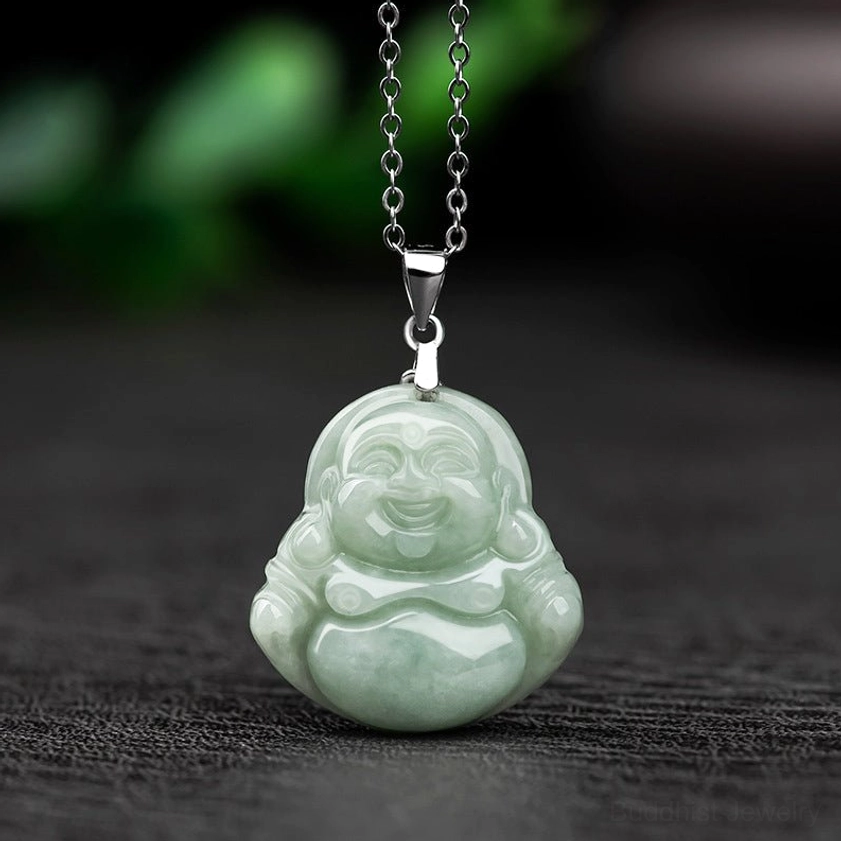 Natural jade Laughing Buddha pendant necklace front view flat lay with light green Maitreya carved jade and silver clasp on dark background