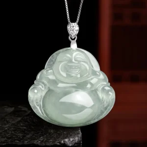 Natural light green jade Laughing Buddha pendant necklace front view with titanium steel chain on stone base