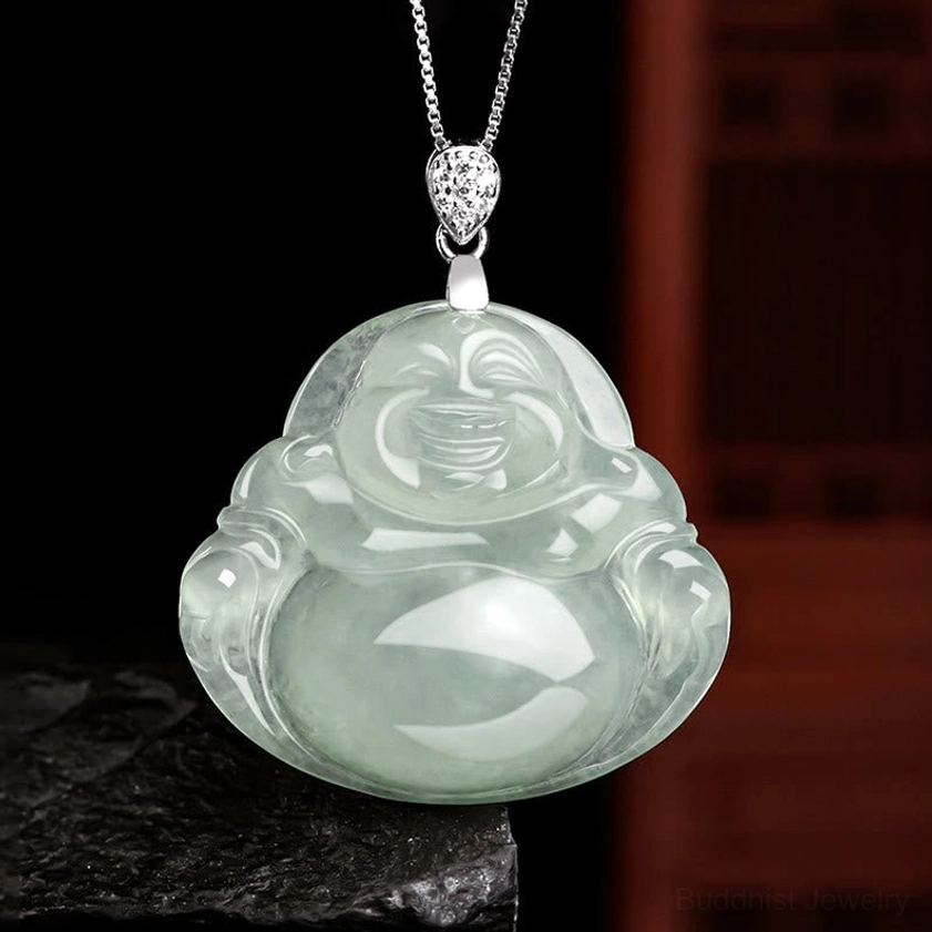 Natural light green jade Laughing Buddha pendant necklace front view with titanium steel chain on stone base