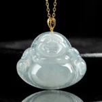 Authentic natural jade Laughing Buddha pendant necklace with gold bail, front overhead view showing translucent light green jade carving