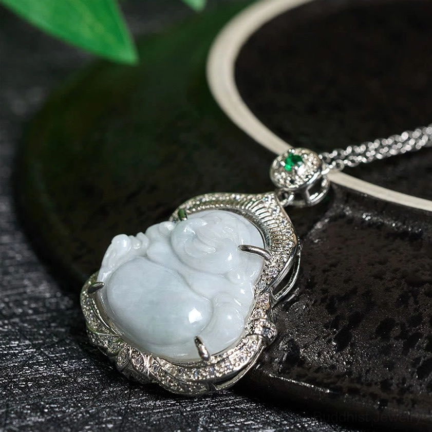 Jade Laughing Buddha pendant high angle view displaying silver crystal encrusted frame and green stone bail