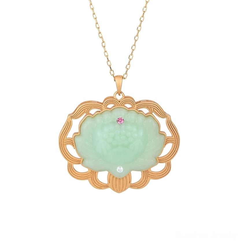 Natural jade lotus pendant necklace flat lay - pristine front view showing ornate gold border frame, light green carved jade lotus, and red and clear gemstone highlights