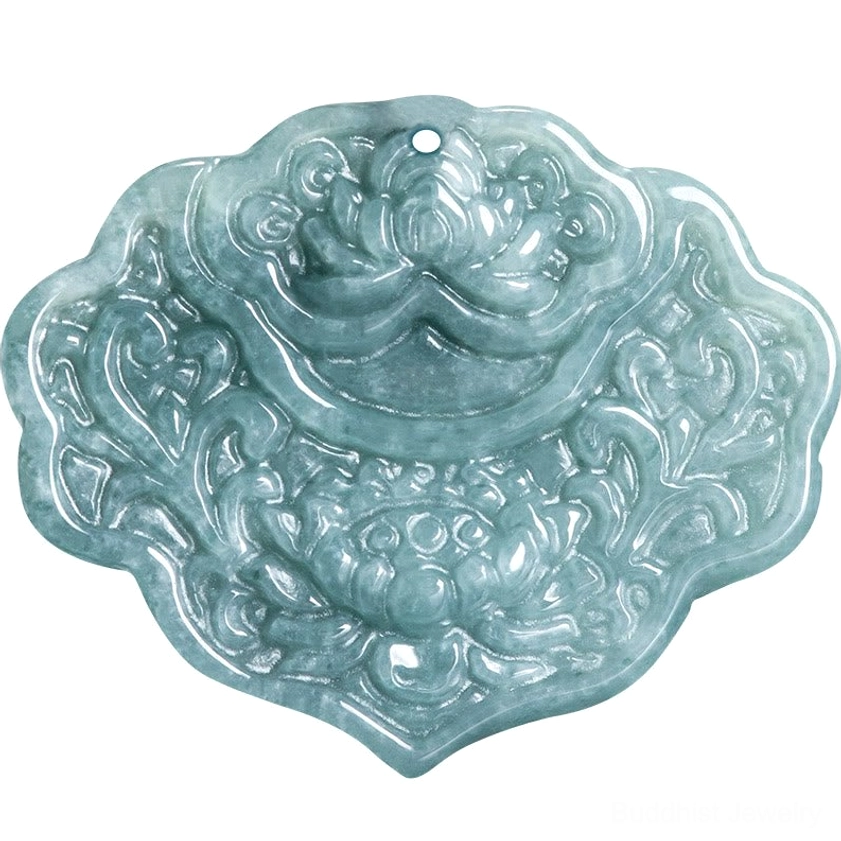 Detailed close-up of carved jade lotus pendant showing intricate lotus flower and scroll carvings on bluish-green stone with top hanging hole for threading