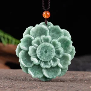 Hand-carved natural green jade lotus pendant necklace with brown cord and orange bead accent, Buddhist prosperity symbol