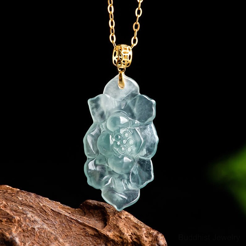 Natural jade lotus pendant necklace with gold-toned titanium steel chain, front view showing intricate 3D carved lotus pattern in translucent cyan-blue jade
