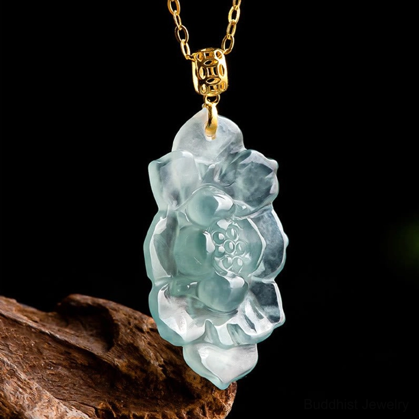 Jade lotus necklace worn on collarbone with white ruffled top showing elegant dainty design and gold-toned chain placement on skin