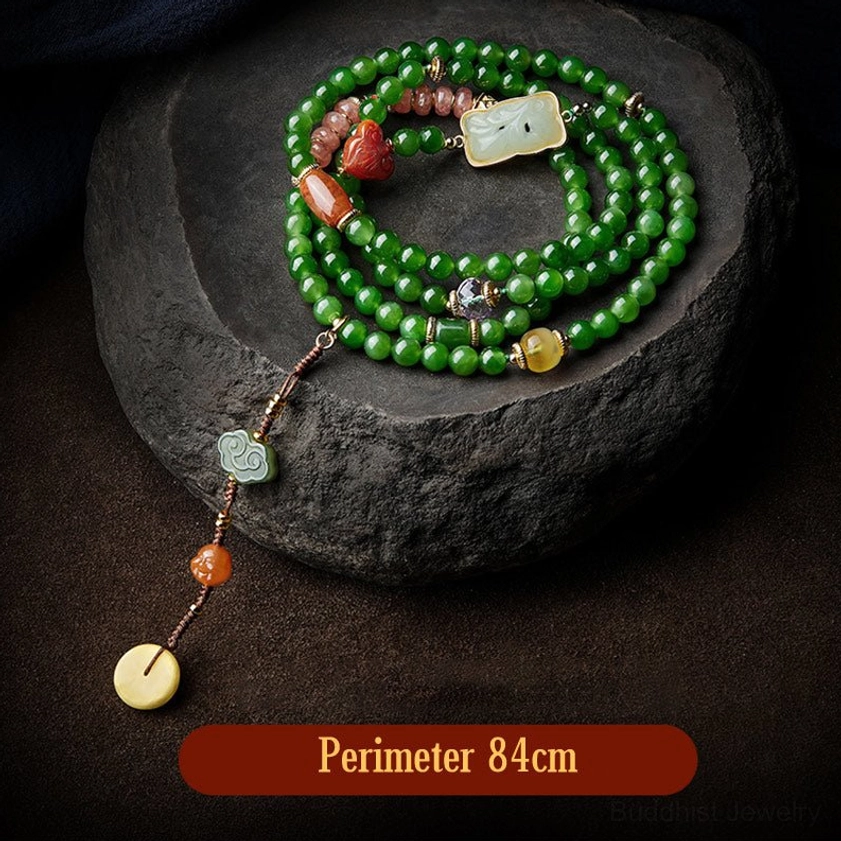 Jade and agate mala bracelet with multiple carved jade charms and accessories