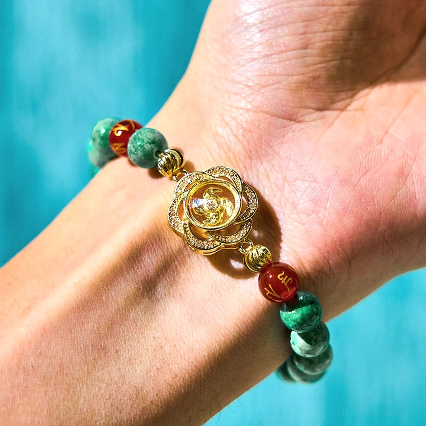 Prosperity jade bracelet worn on wrist with close-up view showing bead details and rotating charm