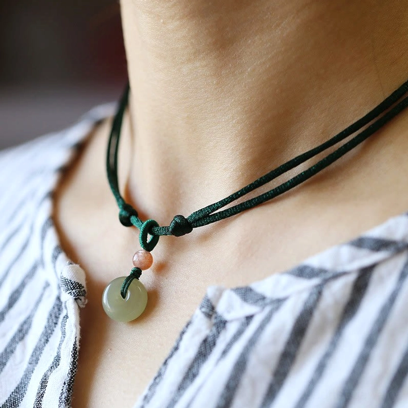 Dark green double-strand jade peace buckle choker necklace worn on neck showing daily wear styling