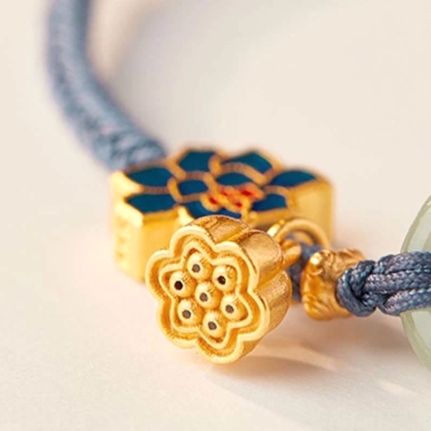 Buddhist peace buckle bracelet highlighting the interlocking jade rings and enamel lotus decoration