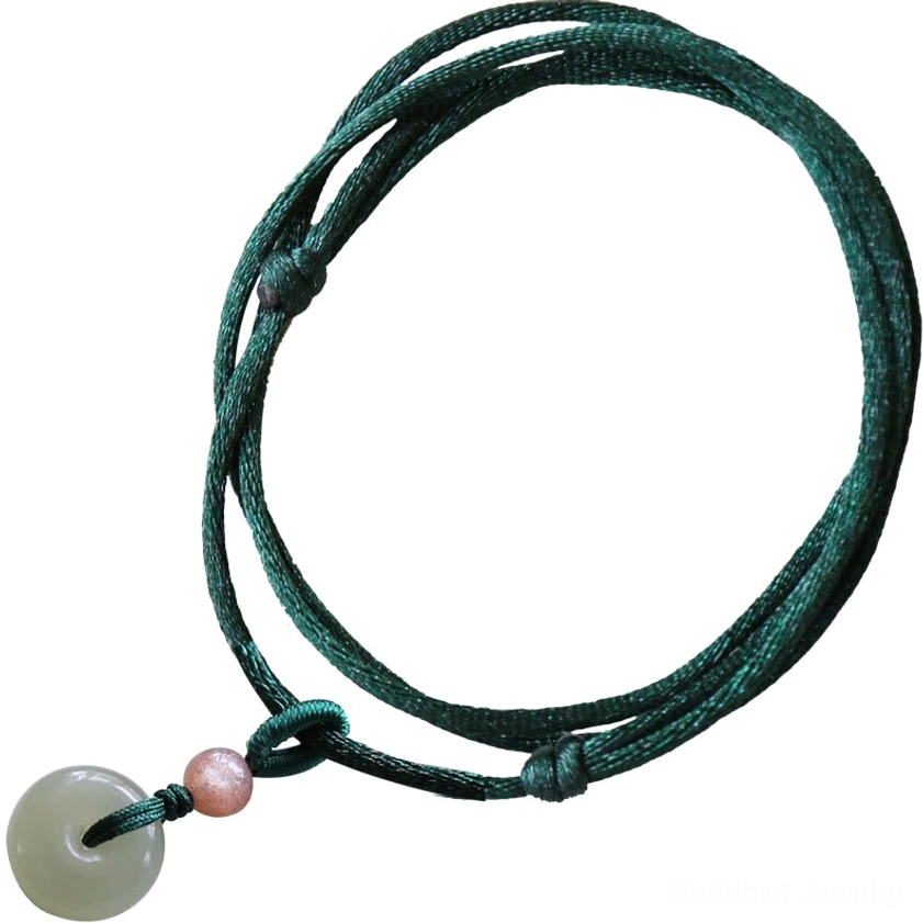 Multi-layer wrapped jade peace buckle necklace with twisted dark green cord on plain background