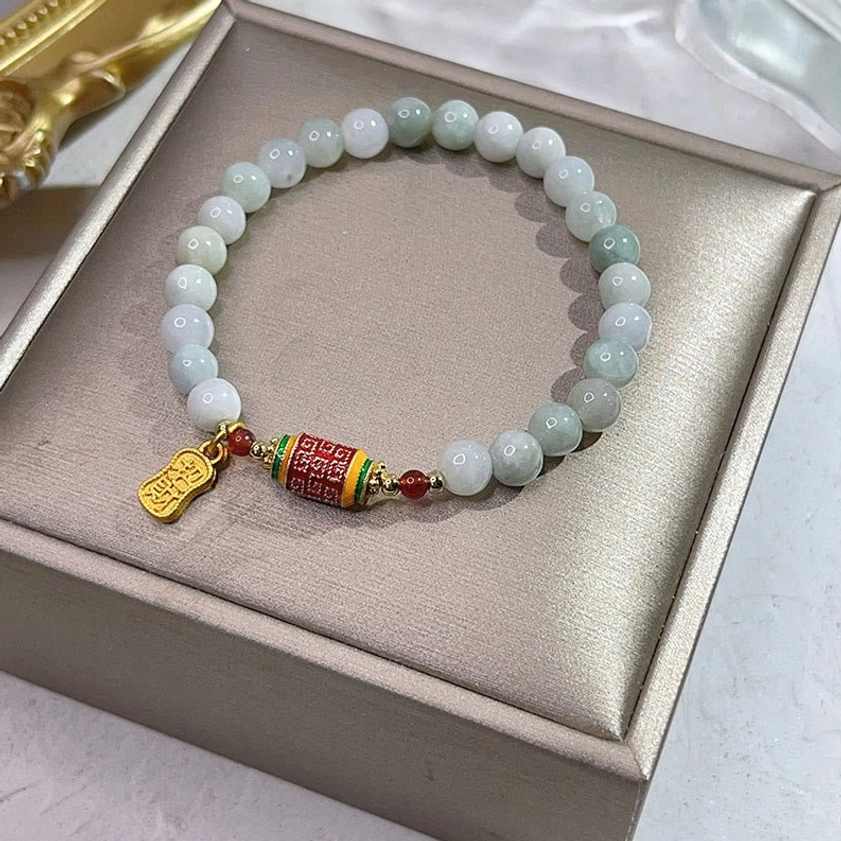 Natural jade prayer wheel Fu character bracelet displayed in luxury gift box with enamel prayer barrel and gold pendant