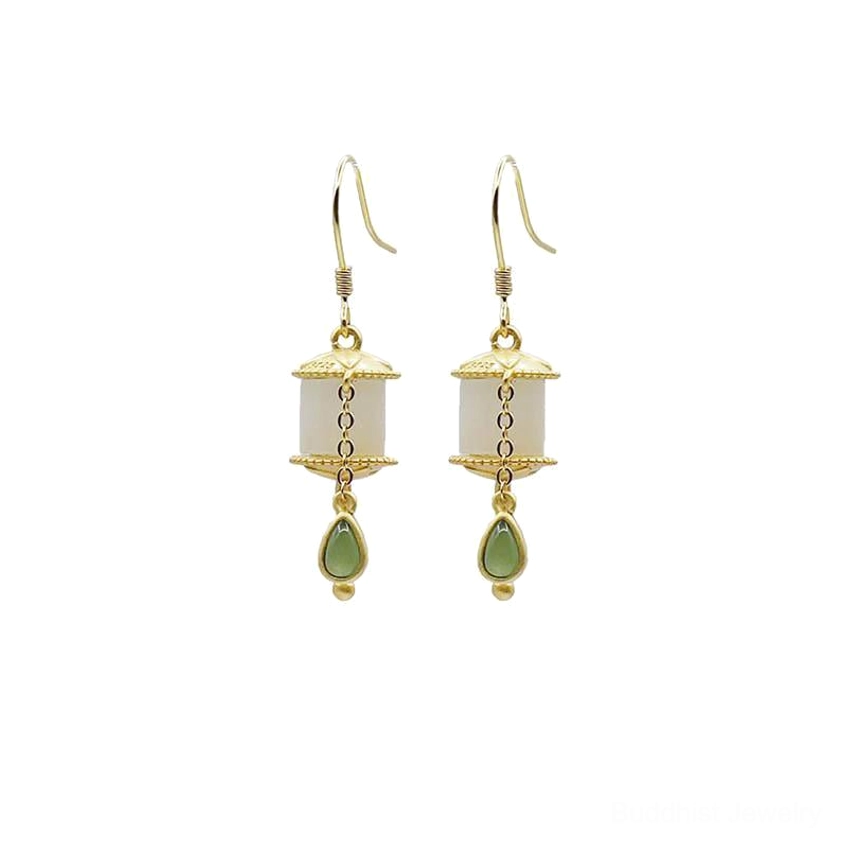 Buddhist jade prayer wheel earrings spiritual meaning infographic highlighting prosperity abundance protection and inner peace benefits