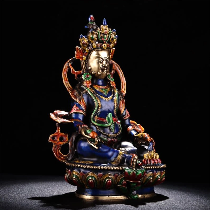 Jambhala Buddha figurine left side view displaying ornate crown, colored decorative trims, and seated lotus pose