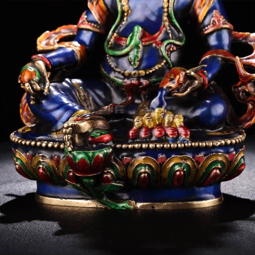 Jambhala Bodhisattva lower torso close-up featuring mongoose in left hand treasure jewels in right hand and ornate lotus pedestal