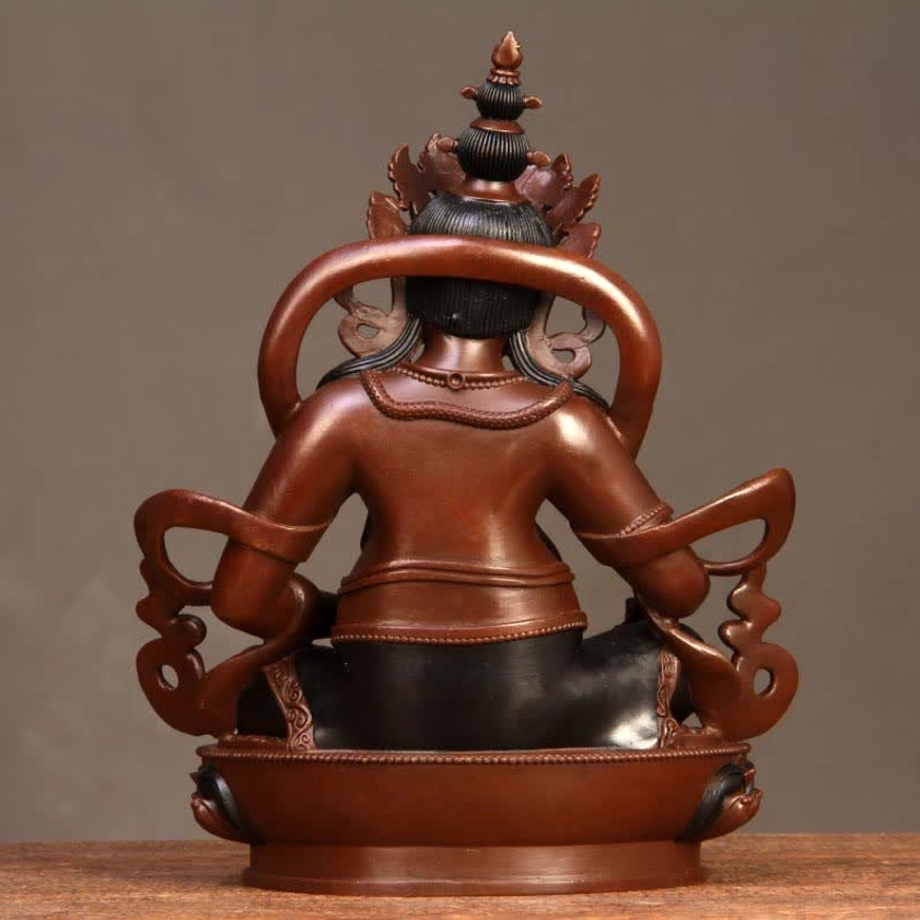 Yellow Jambhala wealth Buddha statue complete view for home altar or meditation space