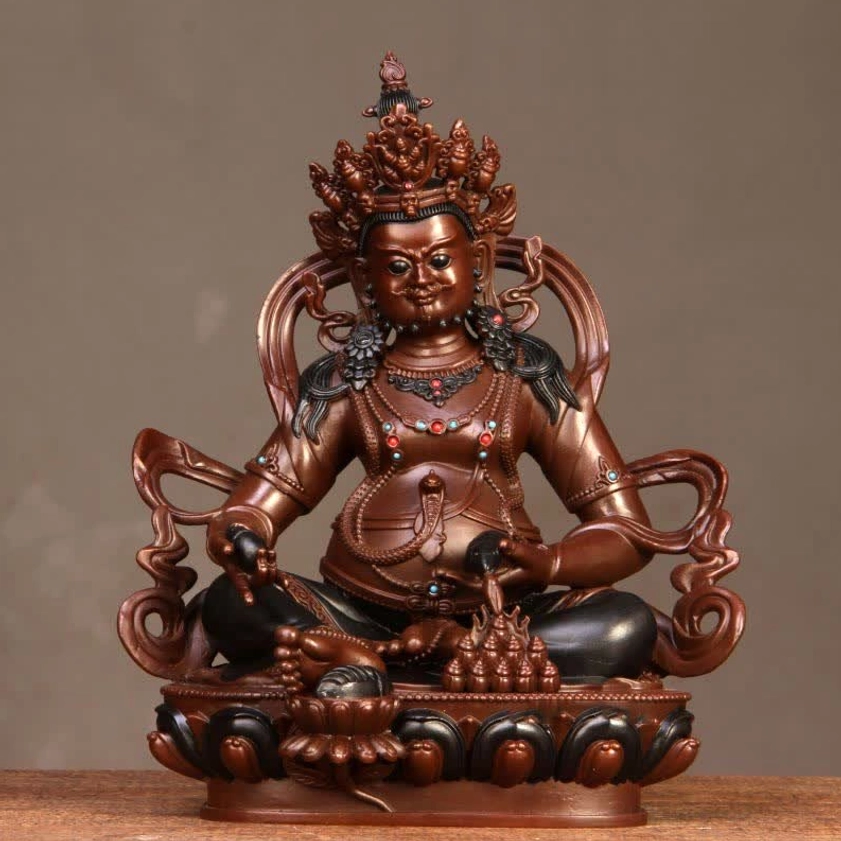 Yellow Jambhala statue right-front angle displaying decorative details and natural copper finish