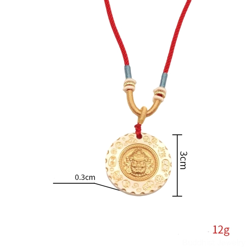 Yellow Jambhala wealth god pendant necklace close-up showing craftsmanship detail of two-tone metal finish and braided rope construction