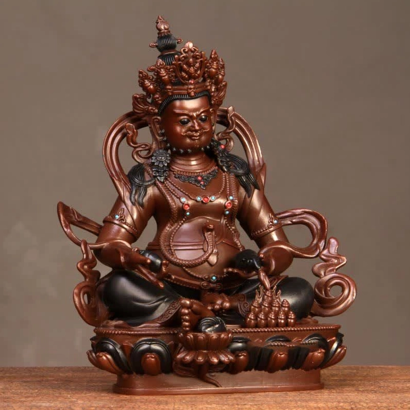 Jambhala Buddha figurine left-front angle showing hand mudra and carved lotus base