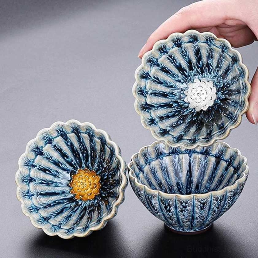Multiple handmade jian zhan lotus cups display showing unique glaze variations and patterns