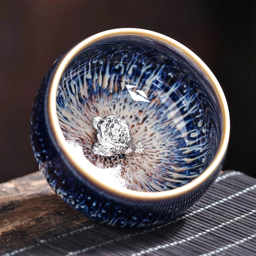 Jian Zhan ceramic tea cup rabbit zodiac sign design with handcrafted glaze pattern and protective energy symbolism