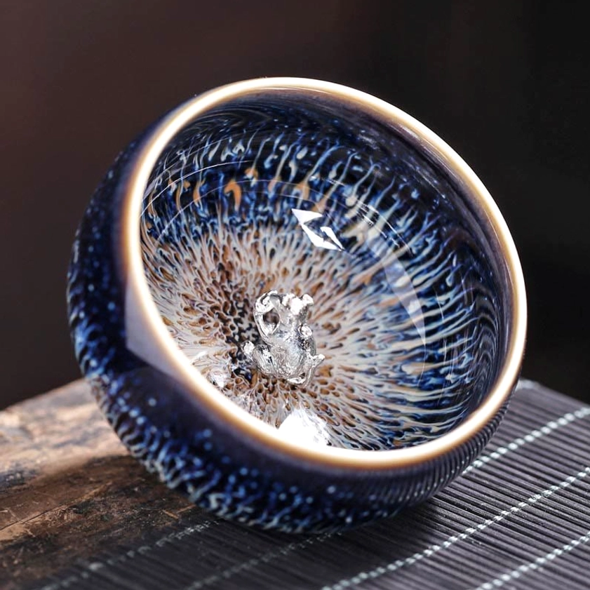 Jian Zhan ceramic tea cup snake zodiac sign design with mindfulness glaze pattern and spiritual symbolism