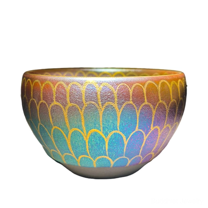 Handcrafted Jianzhan lotus teacup featuring blue, purple, and warm brown gradient with gilded scale-like lotus petal patterns, studio view