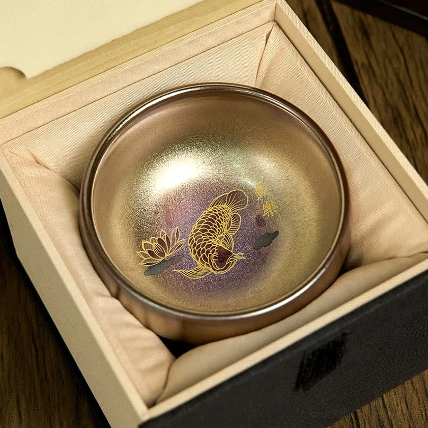 Jianzhan koi fish lotus tea cup in velvet-lined gift box packaging, oblique top-down view
