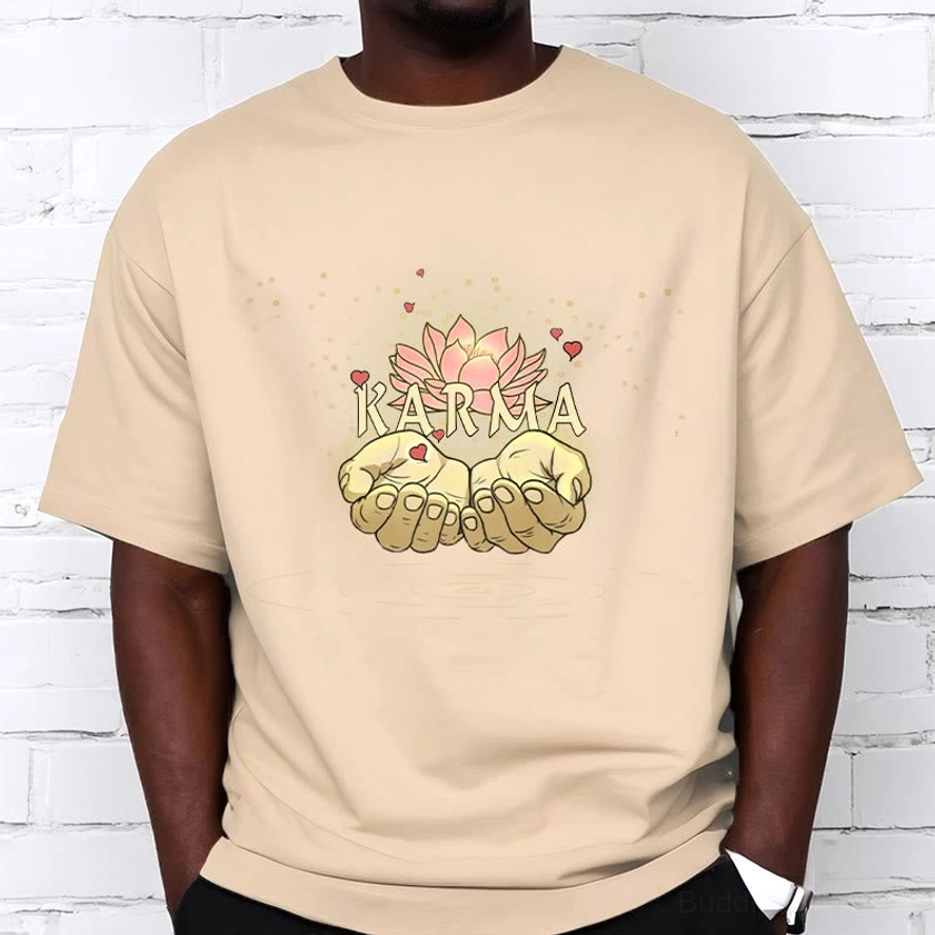 Light grey karma graphic t-shirt, front upper-body view worn by model against neutral background