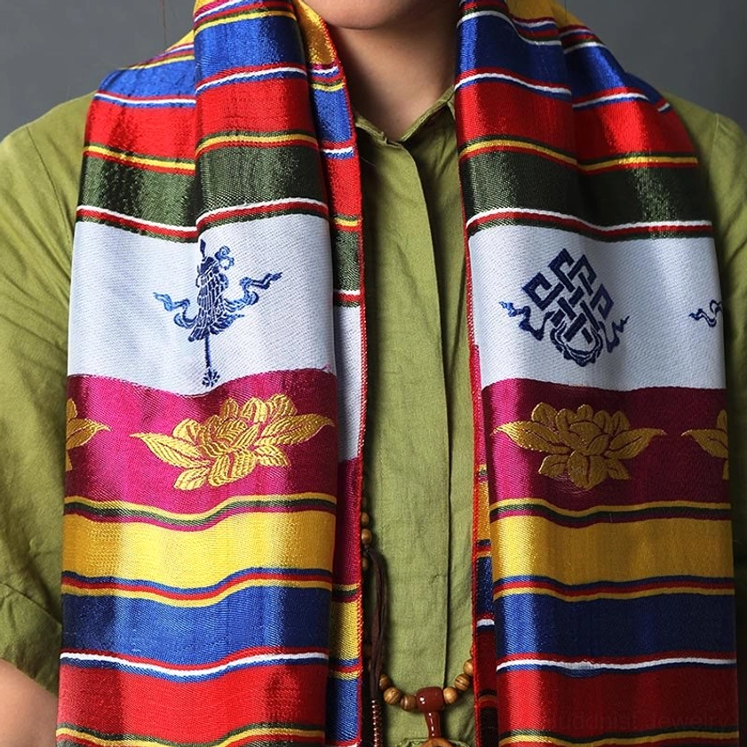 Sacred Khata blessing scarf worn on neck showing Tibetan lucky patterns and colorful striped textile design