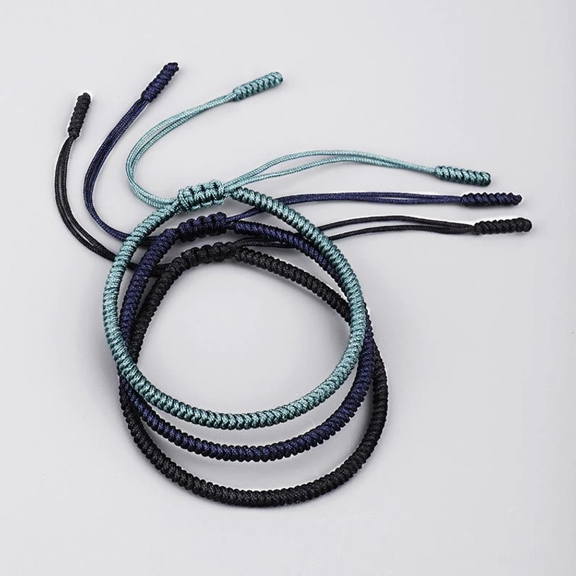 King Kong knot Buddhist bracelets showing adjustable long tail cords - handcrafted protection amulet design